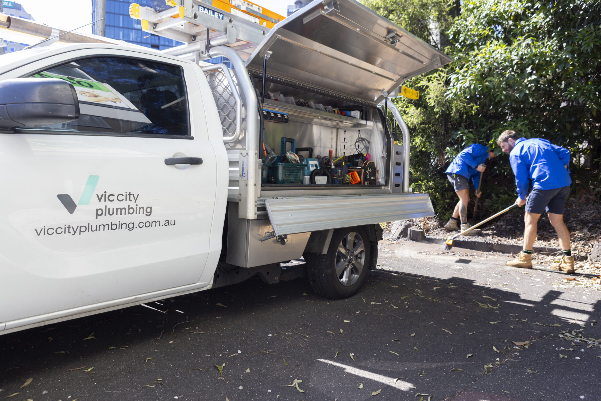 Vic City Plumbing plumbers doing clean up after work done